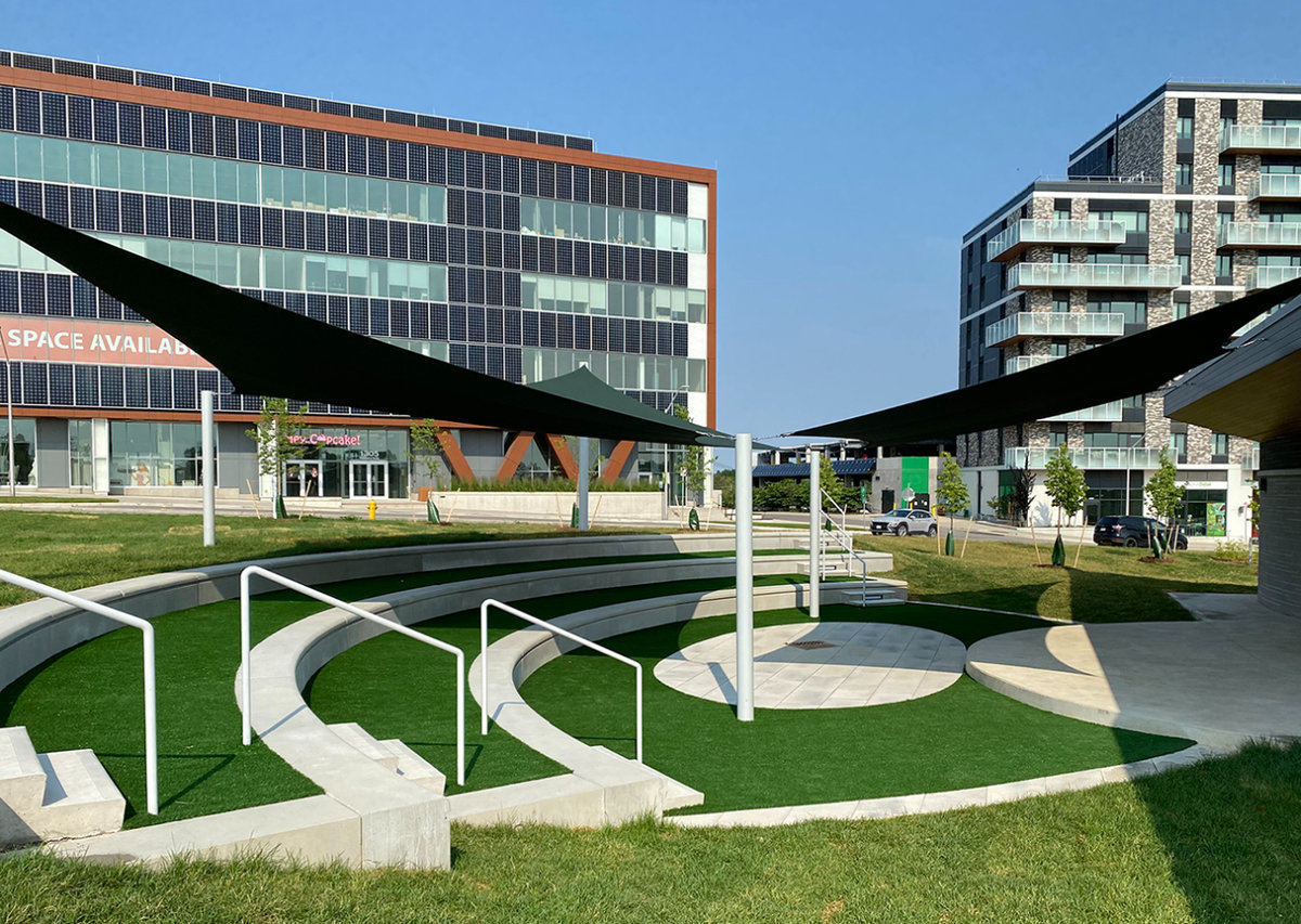 Small amphitheater with grass on each level.