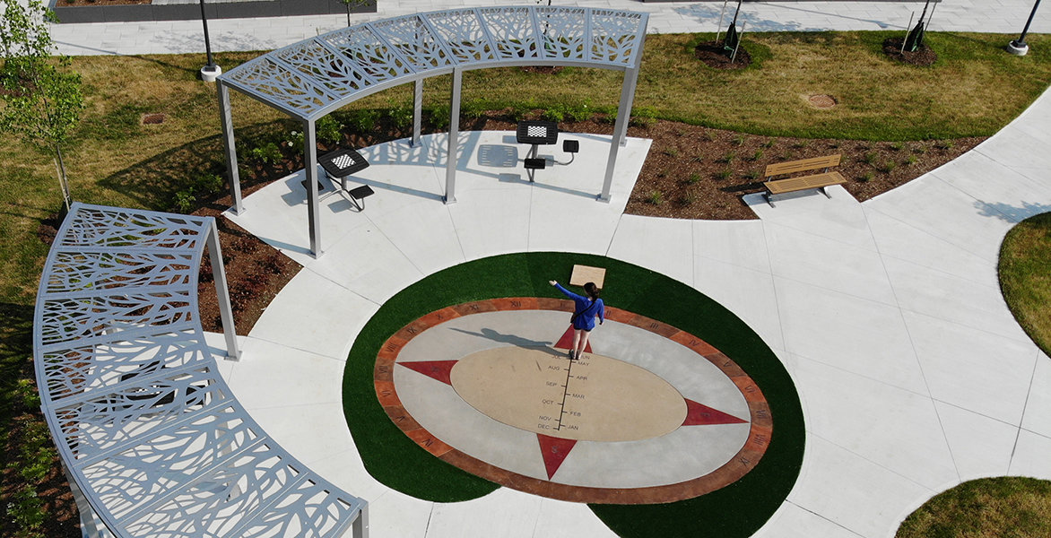 Aerial view of a small park with a couple tables.